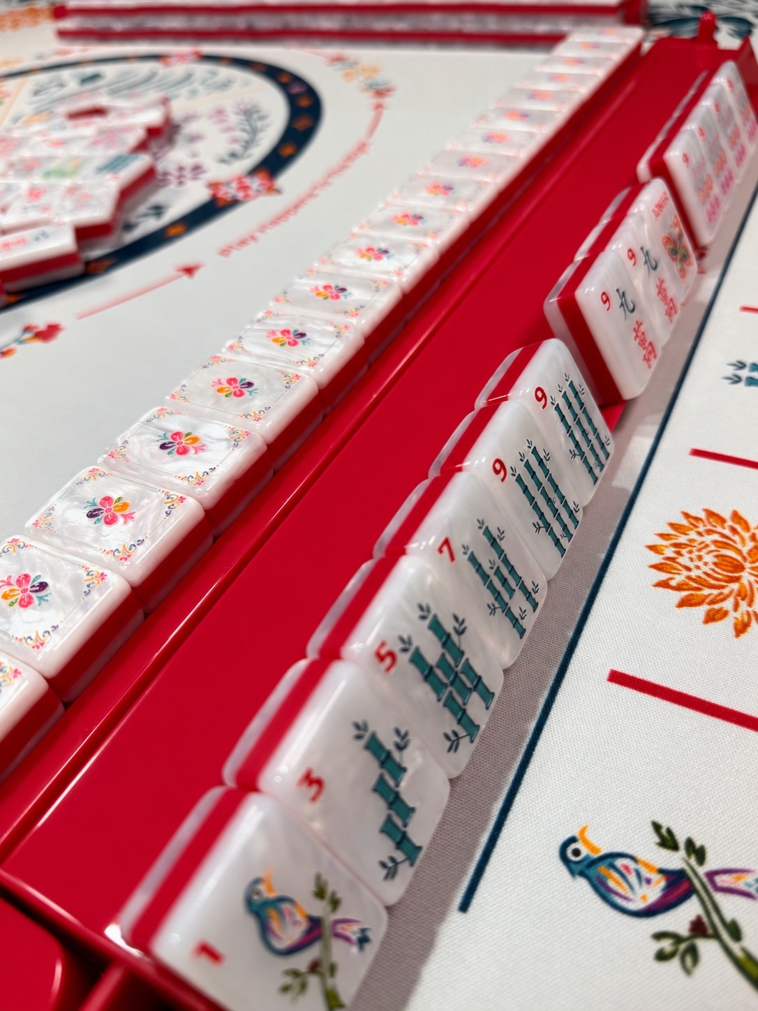 Mahj-Onn Signature bamboo tiles standing on a red Mahjong rack
