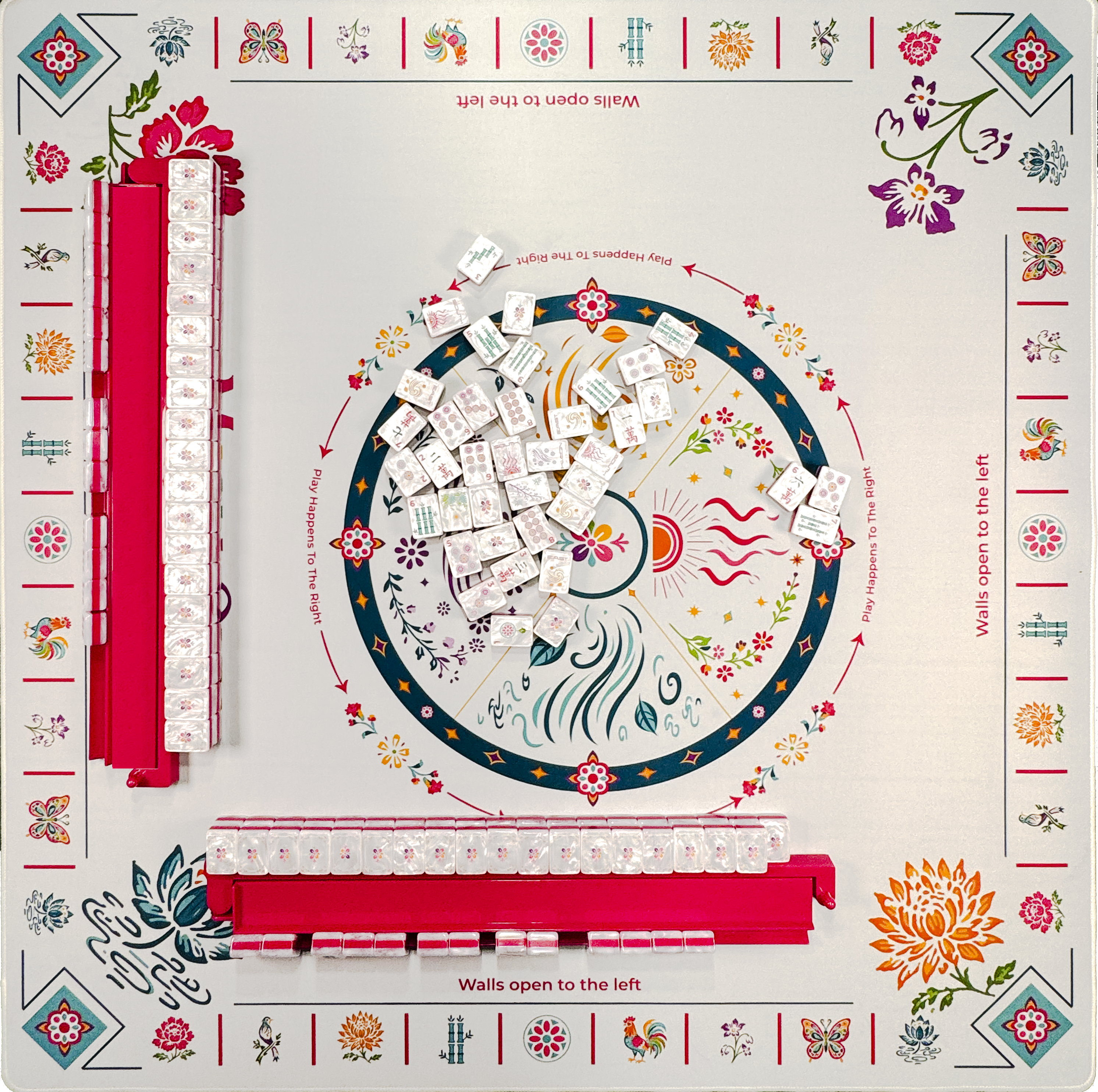 Mahj-Onn Signature tiles and red racks arranged on the matching illustrated Mahjong mat